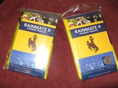 LOT OF TWO (2) WYOMING COWBOYS, ADULT SIZE, POLYETHYLENE HOODED PONCHOS