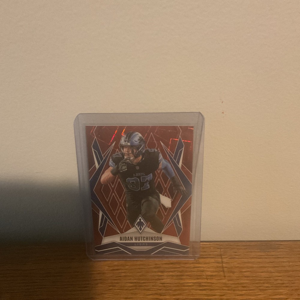 2025 Panini Phoenix – Aidan Hutchinson #21 Red Lazer /199