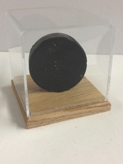 Hockey puck acrylic plastic display case with solid hardwood oak base