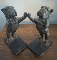 2 steel bulldogs playing pattycake the weight of both 5pounds 10.9oz book ends