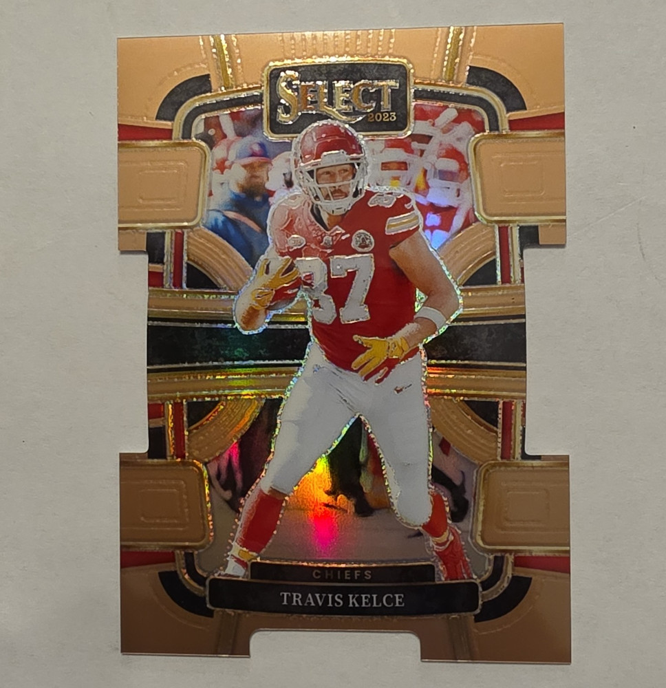 Panini Select 2023 Concourse Travis Kelce #50 Copper Prizm Die-Cut 011/299