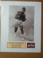 Signed Joe Frazier 5×7 b&w photo matted to 8×10 w/coa